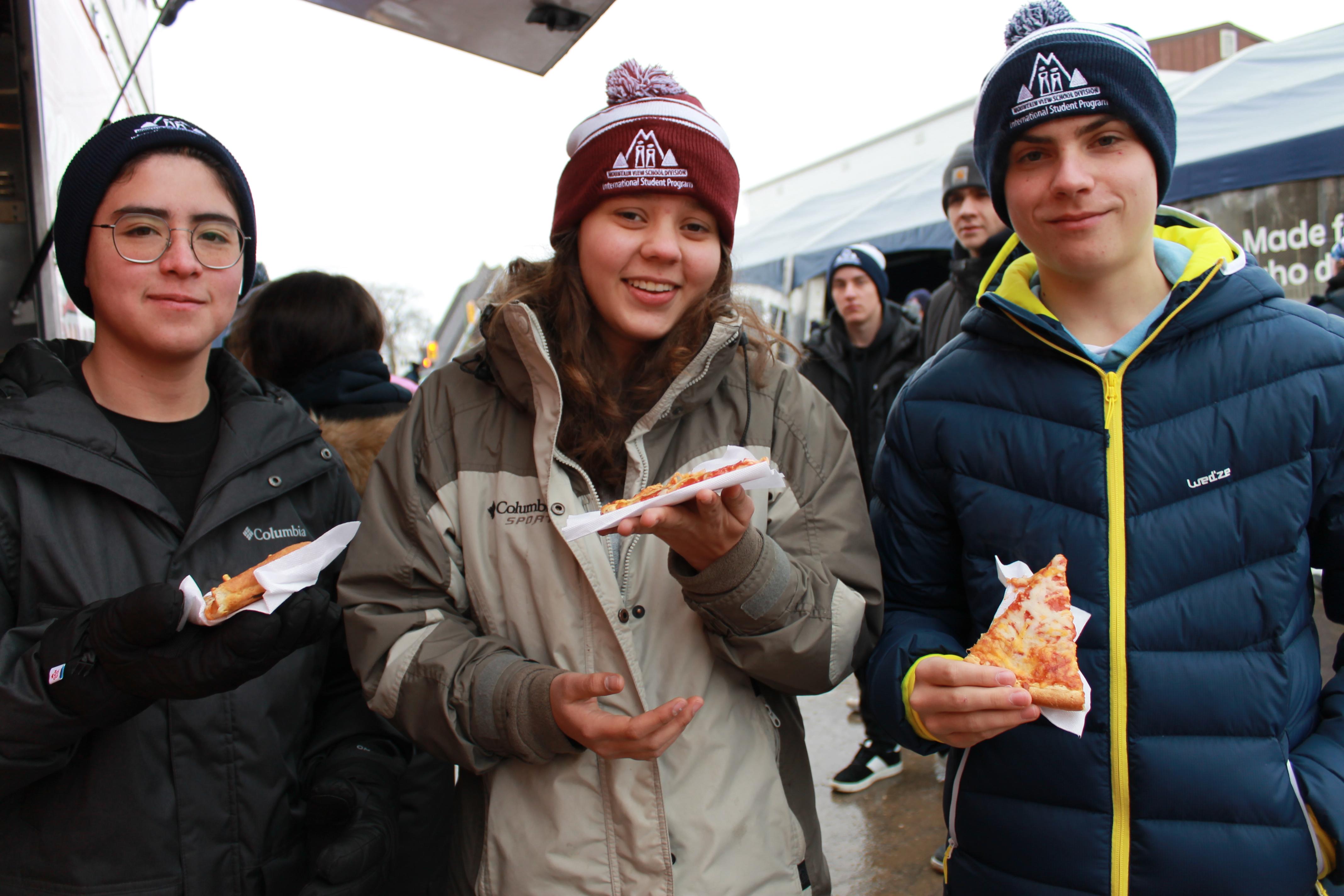 students enjoying free pizza